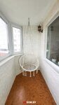 Ремонт балкона. Декоративный белый камень, пробковый пол, подвесное кресло, камин, Минск 114